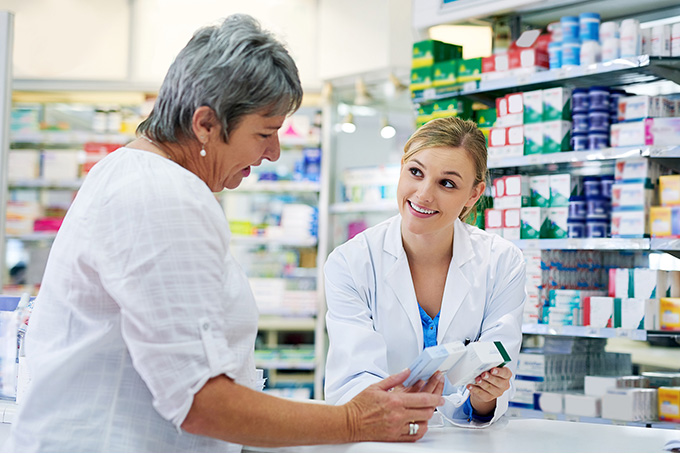 Pharmacy Application | Pharmacist Helping a Customer